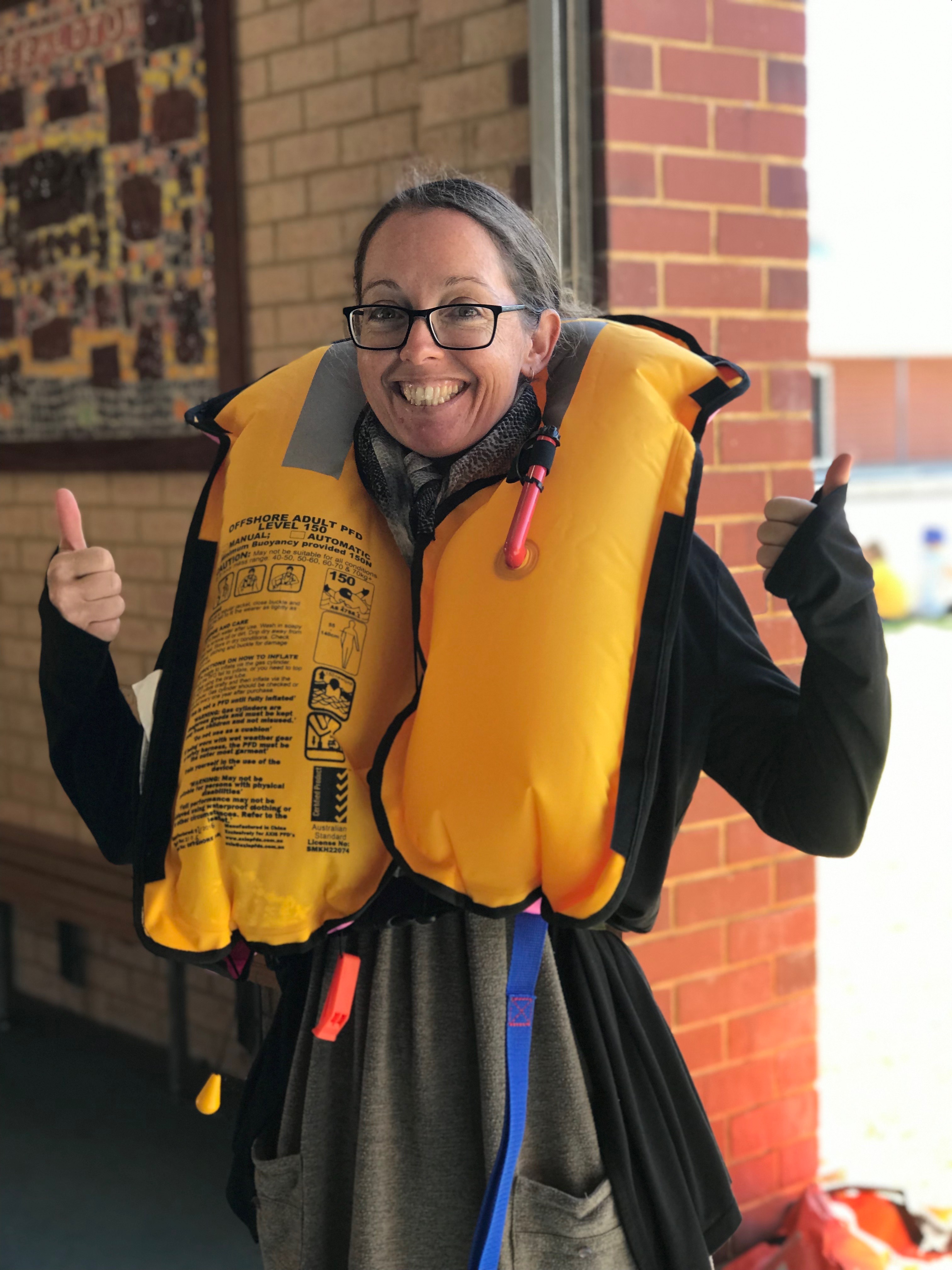 Year 3 Teacher Tamara Kuipers demonstrating a life jacket
