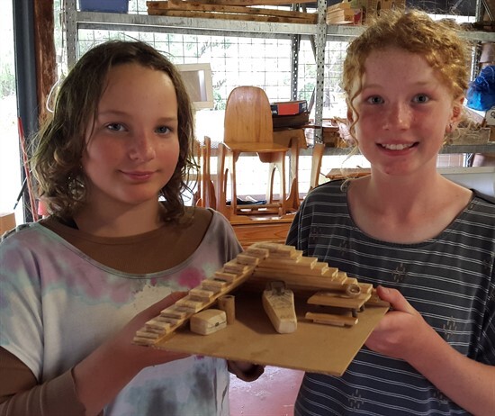 Meg and Freya show the inside of their model pyramid