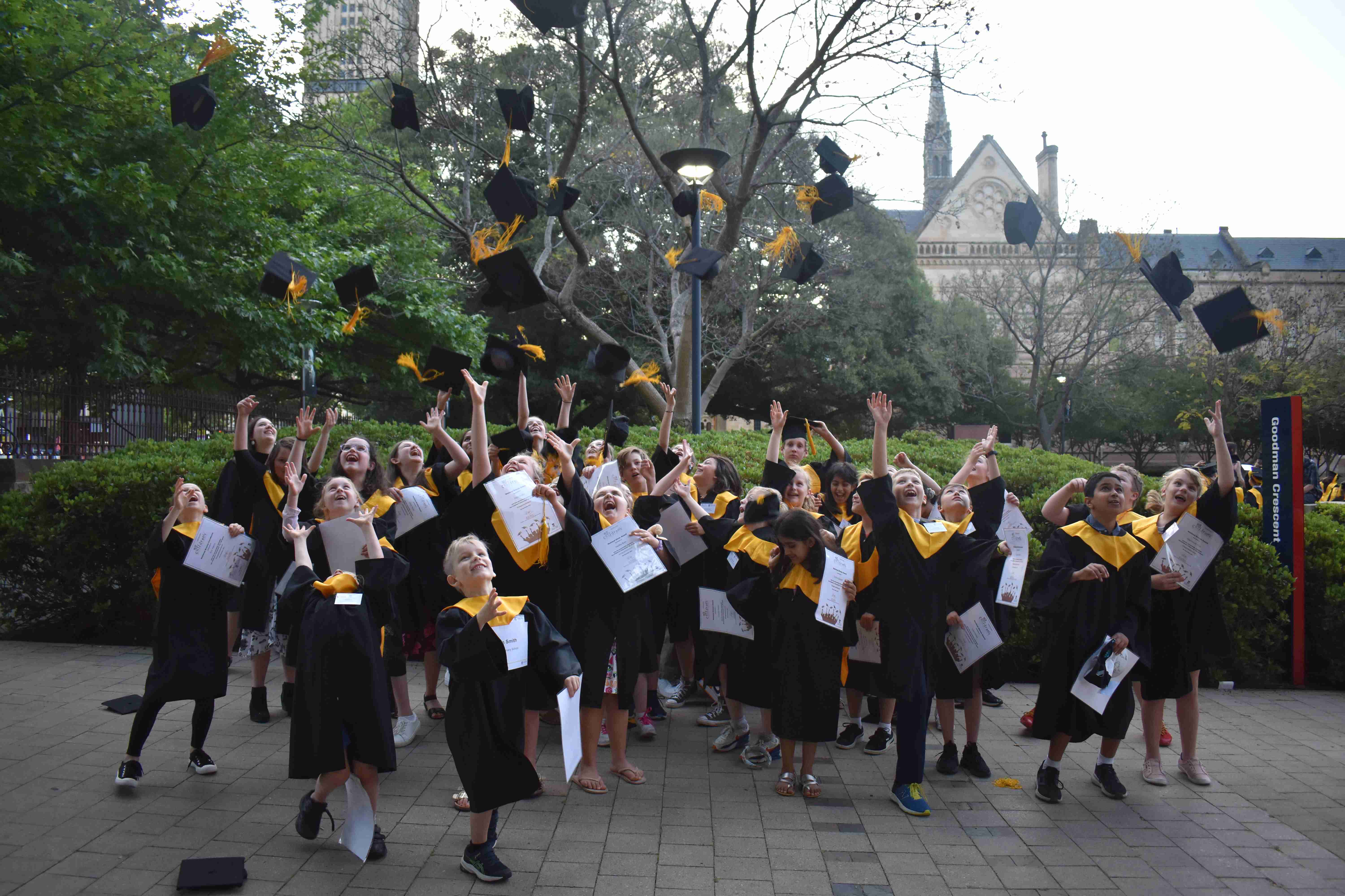 Students throwing hats