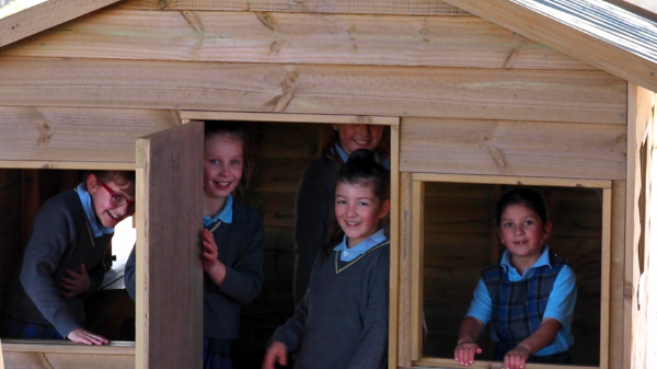 Students in wooden house