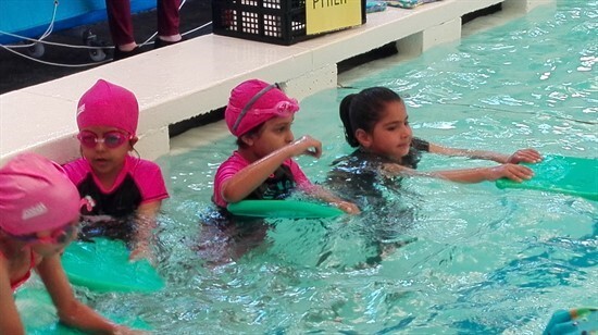 Students enjoying their swimming sessions