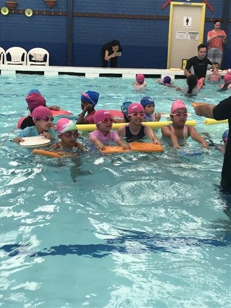 Students enjoying their swimming sessions