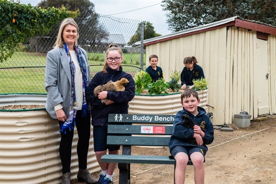 Swansea PS teacher Sophie Wilson with students Chloe and Xavier and their new Buddy Bench