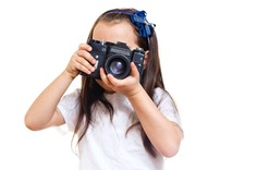 Young_girl_with_camera_vecteezy.jpg